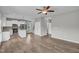 Open-concept kitchen and living room with stainless steel appliances and hardwood flooring at 173 Forsyth Pkwy Pkwy, Clayton, NC 27520