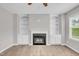Spacious living room featuring a cozy fireplace and built-in shelving units at 173 Forsyth Pkwy Pkwy, Clayton, NC 27520