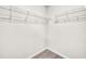 Walk-in closet with wall-mounted metal shelves at 173 Forsyth Pkwy Pkwy, Clayton, NC 27520