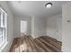 Comfortable bedroom featuring wood floors and neutral paint at 1908 Rocky Cross Rd, Zebulon, NC 27597