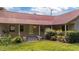 Charming home featuring a durable red metal roof, front porch and well-maintained lawn at 1908 Rocky Cross Rd, Zebulon, NC 27597