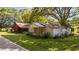 A charming pair of aged structures nestled amidst a grassy lawn and trees at 1908 Rocky Cross Rd, Zebulon, NC 27597