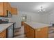 Updated kitchen with stainless steel appliances and a center island for cooking and entertaining at 1908 Rocky Cross Rd, Zebulon, NC 27597
