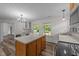 Kitchen with laminate flooring, stainless steel appliances, and center island at 1908 Rocky Cross Rd, Zebulon, NC 27597