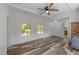 Bright living room featuring wood floors and windows providing ample natural light at 1908 Rocky Cross Rd, Zebulon, NC 27597