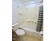Bathroom featuring tub with shower, toilet, and built in shelving in shower at 2006 N Ashland Dr, Burlington, NC 27217