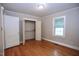 Cozy bedroom features hardwood floors, a closet, natural light, and neutral paint at 2006 N Ashland Dr, Burlington, NC 27217