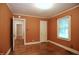Bedroom featuring hardwood floors, neutral paint, and window with natural light at 2006 N Ashland Dr, Burlington, NC 27217