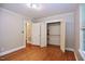 Bedroom with hardwood floors, closet and access to other rooms at 2006 N Ashland Dr, Burlington, NC 27217