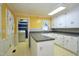Eat-in kitchen features laundry room access, sink and gray countertop at 2006 N Ashland Dr, Burlington, NC 27217
