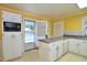 Eat-in kitchen has a door to the exterior and microwave appliance at 2006 N Ashland Dr, Burlington, NC 27217