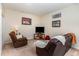 Finished basement with comfortable seating, TV, and accent decor at 227 Kenmont Dr, Holly Springs, NC 27540