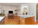 Open-concept kitchen with stainless appliances and breakfast nook with natural light at 227 Kenmont Dr, Holly Springs, NC 27540