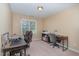 Functional office space features two desks, comfortable chairs, and bright natural light at 227 Kenmont Dr, Holly Springs, NC 27540