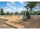 Community playground with swings, slide, and climbing structure for hours of outdoor fun at 227 Kenmont Dr, Holly Springs, NC 27540