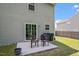 An outdoor patio with chairs for relaxing, offering a comfortable space for outdoor enjoyment at 228 Botanical Ct, Bunnlevel, NC 28323