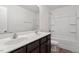 Bathroom featuring double sink vanity, a toilet, and a shower and bath combination at 228 Botanical Ct, Bunnlevel, NC 28323
