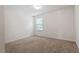 Cozy bedroom featuring carpet, neutral paint, and a window at 228 Botanical Ct, Bunnlevel, NC 28323