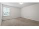 Bright bedroom featuring carpet, neutral paint, and large window at 228 Botanical Ct, Bunnlevel, NC 28323