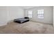 This bedroom features neutral carpet and lots of natural light from two windows at 228 Botanical Ct, Bunnlevel, NC 28323