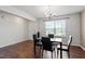 Bright dining room featuring wood floors, a chandelier, and a window with natural light at 228 Botanical Ct, Bunnlevel, NC 28323