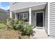 Charming front door area with beautiful landscaping and a welcoming entrance at 228 Botanical Ct, Bunnlevel, NC 28323