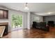 Bright living room features an open floor plan, sliding glass doors, and ample seating at 228 Botanical Ct, Bunnlevel, NC 28323
