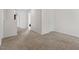 Upstairs hallway featuring carpet, neutral paint, and white trim at 228 Botanical Ct, Bunnlevel, NC 28323