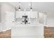 Open kitchen island with stainless steel appliances, white countertops and undermount sink at 260 Pretty Run Branch Ln, Wendell, NC 27591