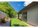 Well-maintained backyard features a green lawn, defined landscaping, and a modern home exterior with large windows at 2805 Van Dyke Ave, Raleigh, NC 27607