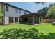 Expansive backyard featuring a covered patio, lush green lawn, and a well-maintained landscape at 2805 Van Dyke Ave, Raleigh, NC 27607