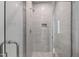Modern glass-enclosed shower featuring sleek fixtures and minimalist design, providing a luxurious bathing experience at 2805 Van Dyke Ave, Raleigh, NC 27607