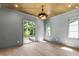 Bright bedroom with beautiful windows, hardwood floors, wood ceiling, and stylish light fixture, creating a serene space at 2805 Van Dyke Ave, Raleigh, NC 27607