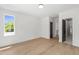 Bright bedroom with hardwood floors and access to a bathroom with a glass shower at 2805 Van Dyke Ave, Raleigh, NC 27607