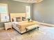 Serene bedroom with neutral tones, a plush bed, white nightstands, and ample natural light at 2805 Van Dyke Ave, Raleigh, NC 27607