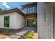 Elegant home entrance showcasing a modern exterior with brick accents, stepping stone pathway, and well-maintained landscaping at 2805 Van Dyke Ave, Raleigh, NC 27607