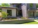 Modern two-story home with brick and siding, manicured landscaping, and black framed windows at 2805 Van Dyke Ave, Raleigh, NC 27607