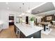 Modern kitchen with stainless steel appliances, an island and views into the open floor plan at 2805 Van Dyke Ave, Raleigh, NC 27607