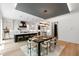 Bright open concept kitchen with a kitchen island, a dining table, and stainless steel appliances at 2805 Van Dyke Ave, Raleigh, NC 27607