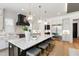 Bright kitchen features stainless steel appliances, gray cabinets, and an island with seating at 2805 Van Dyke Ave, Raleigh, NC 27607