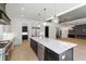 This kitchen features an island with stainless steel appliances, and an open layout into an adjoining living area at 2805 Van Dyke Ave, Raleigh, NC 27607