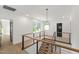 Second story landing with a modern railing staircase, wood floors, and a view of the yard at 2805 Van Dyke Ave, Raleigh, NC 27607
