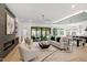 Spacious living room with fireplace, hardwood floors, and open floor plan at 2805 Van Dyke Ave, Raleigh, NC 27607