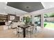 Open-concept floor plan showing dining and living area with neutral tones, built-ins and hardwood floors at 2805 Van Dyke Ave, Raleigh, NC 27607