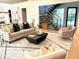 Inviting living room with modern staircase, open floor plan, comfortable seating, and stylish decor at 2805 Van Dyke Ave, Raleigh, NC 27607