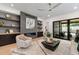 Living room with modern fireplace, built-in shelving and hardwood floors at 2805 Van Dyke Ave, Raleigh, NC 27607