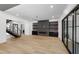 Living room with sleek fireplace, built-ins, and sliding doors at 2805 Van Dyke Ave, Raleigh, NC 27607