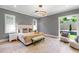 Main bedroom with natural light, neutral colors, and hardwood floors at 2805 Van Dyke Ave, Raleigh, NC 27607