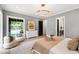 Main bedroom with closet access, natural light, and hardwood floors at 2805 Van Dyke Ave, Raleigh, NC 27607