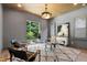 Bright office featuring glass desk, wood ceiling, large windows, and contemporary decor at 2805 Van Dyke Ave, Raleigh, NC 27607